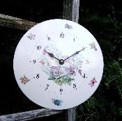 Horloge émaillée motif fleurs bouquet ronde bombée